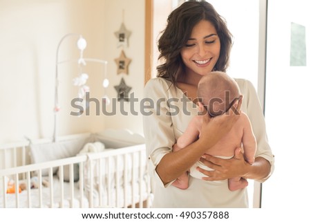 Similar – Image, Stock Photo Young mother with her cute infant baby boy child sitting on bench in city park