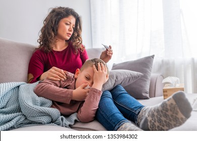 Young Mother Holding Sick Son Child On Hands, Lying On Knees, Touching Head Measuring Temperature, Cold Or Flu, Fever Of Illness, Looking On Thermometer, Cough And Throat Pain, Small Kid, Mother Care