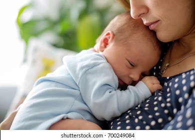 Young Mother, Holding Tenderly Her Newborn Baby Boy, Close Portrait