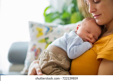 Young Mother, Holding Tenderly Her Newborn Baby Boy, Close Portrait