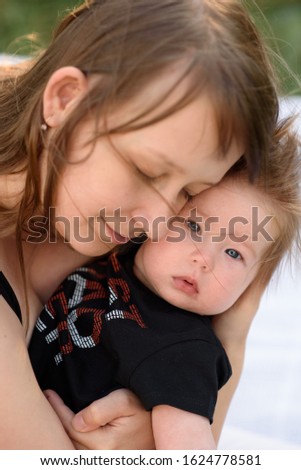 Similar – Image, Stock Photo mother with her daughter asleep in her arms