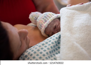 A Young Mother Just After Giving Birth To A Premature Baby Girl Weighing Just 4lbs, Skin To Skin Contact