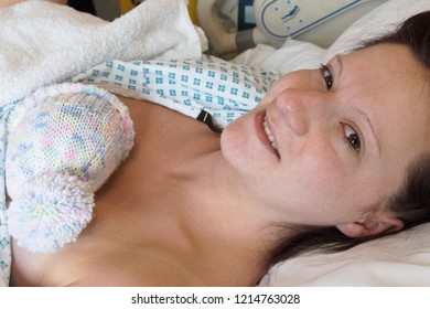 A Young Mother Just After Giving Birth To A Premature Baby Girl Weighing Just 4lbs, Skin To Skin Contact