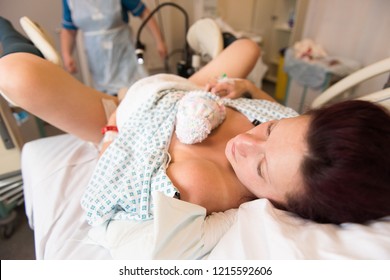 A young mother just after giving birth to a premature baby girl weighing just 4lbs, Skin to skin contact (Shot at a shallow depth of field for obvious reasons)!