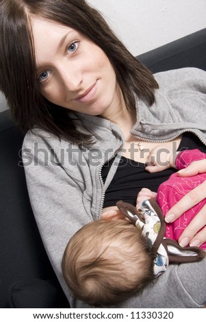 young mother on a sofa with their baby girl