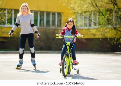 Young Mother Roller Skating Daughter Riding Stock Photo (Edit Now ...