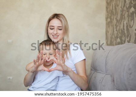 young mother and son of tenderness. counting your toes