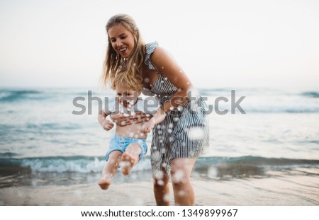 Similar – Image, Stock Photo Mother and toddler with mobile phone in hand