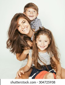 Young Mother With Two Children On White, Happy Smiling Family Inside