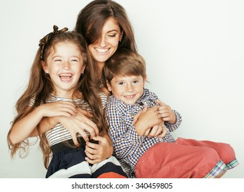 Young Mother With Two Children On White, Happy Smiling Family Inside Isolated