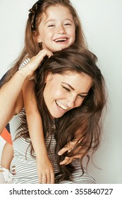 Young Mother With Two Children On White, Happy Smiling Family Inside Isolated Close Up