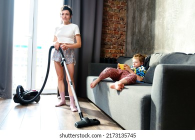 Young Mother Vacuuming Room Her Son Stock Photo 2173135745 | Shutterstock