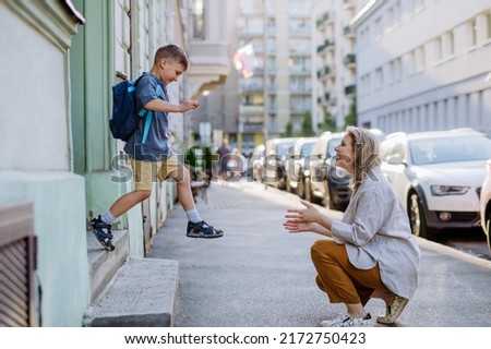 Similar – Image, Stock Photo Young mother with her cute infant baby boy child sitting on bench in city park