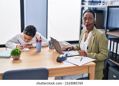 Young Mother Wearing Call Center Agent Headset Scared And Amazed With Open Mouth For Surprise, Disbelief Face 