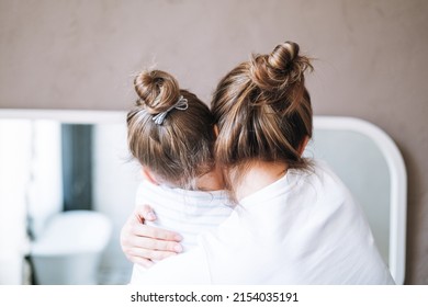 Young Mother Woman With Long Hair With Little Tween Girl Daughter In Pajamas Having Fun In The Morning At Home, Family Spending Time Together In Bathroom