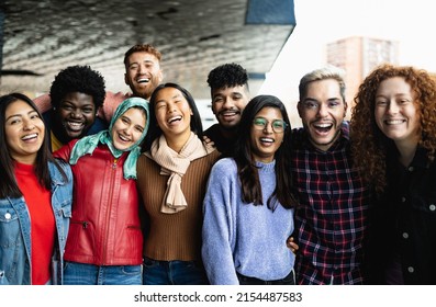 Young multi ethnic friends having fun together hanging out in the city - Friendship and diversity concept - Shutterstock ID 2154487583
