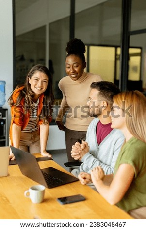Young multiethnic startup team working at the modern office