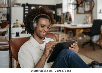 Young multiracial man drawing something in designers studio. - Powered by Shutterstock