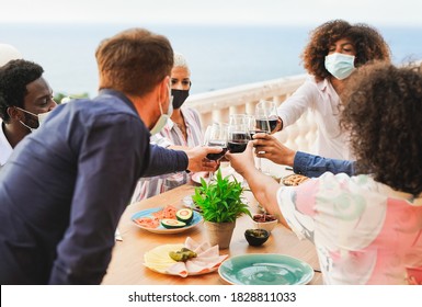 Young Multiracial People Cheering With Wine - Dinner Outdoor While Wearing Protective Face Mask For Coronavirus