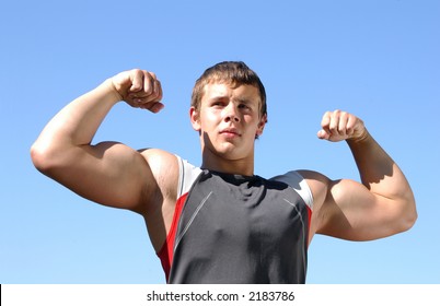 Young Muscular Athlete Showing His Biceps Stock Photo 2183786 ...