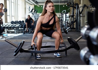 Young Muscular Fit Female With Big Muscles Doing Hard Strength Weightlifting Or Dead Lift, Do Squats With Heavy Barbell