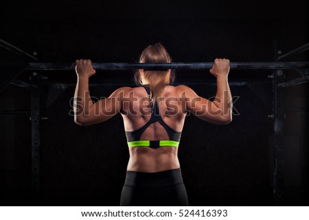 Similar – Image, Stock Photo Rear view portrait of one young middle age athletic woman at crossfit training, exercising with trx suspension fitness straps over dark background