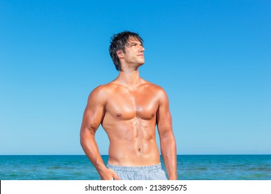 YOung Muscular Man On The Beach