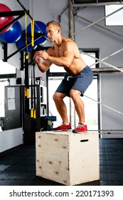 Young Muscular Man Perfecting The Box Jump. Crossfit Training