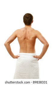 Young Muscular Man Wrapped In A White Towel Isolated On White Background