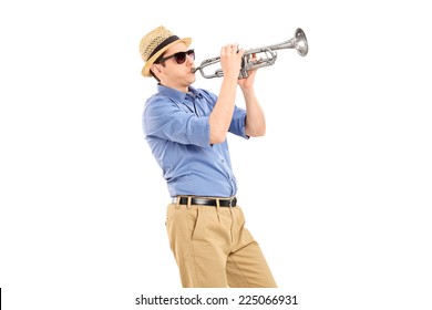 Young musician playing a trumpet isolated on white background