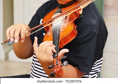 Young musician playing the violin