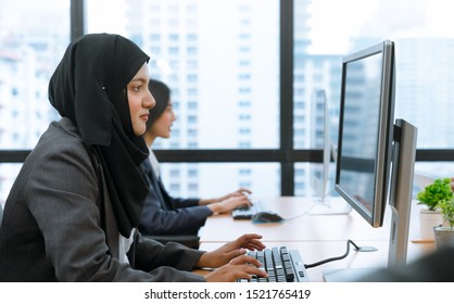 Young Muslim Business Woman Wearing Hijab Working On Computer At Office Workplace.