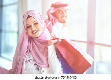Young muslim couple shopping and having fun