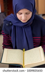 Young Muslim Girl With Qoran