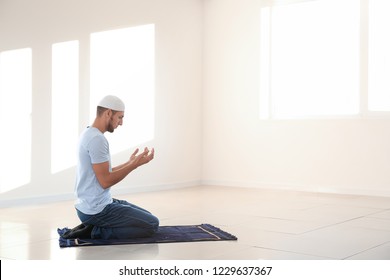 Young Muslim Man Praying At Home