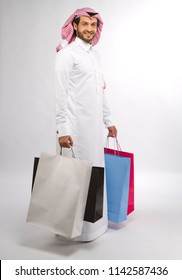 A Young Muslim Man With Shopping Bags In Hand In Super Market In Mall In Saudi Arabia Middle East Gulf