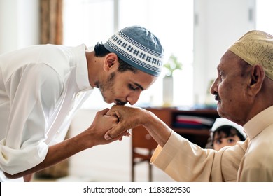 Young Muslim Man Showing Respect To His Father