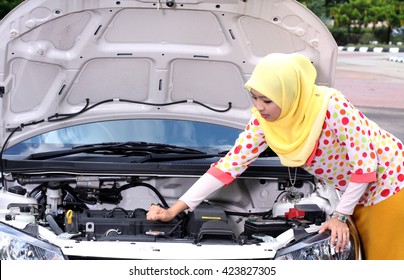 Young Muslim Woman Checking Engine On Stock Photo (Edit Now) 423827305