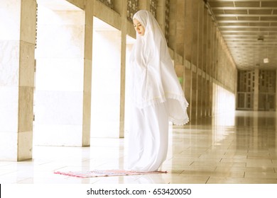 Young Muslim Woman Doing Salat In The Mosque 