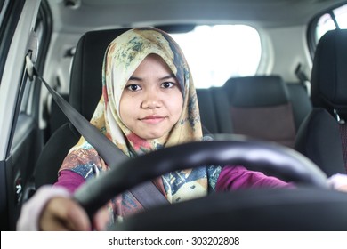 Young Muslim Woman Driving Her Car