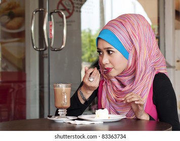 Young Muslim Woman Having Lunch At Cafeteria