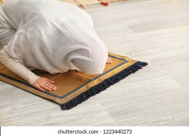 Young Muslim Woman Praying At Home