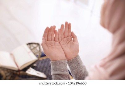 Young Muslim Woman Praying, Indoors. Focus On Hands