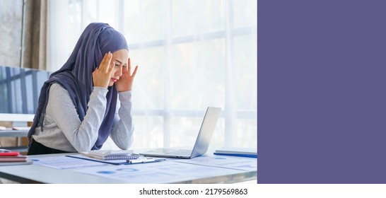 Young Muslim Woman Working In Business Office, Wearing Hijab Works As Start Up SMEs Project, Headache, Migraine, Stress Disorder, Working Hard.