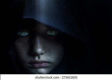 Young Mysterious Fantasy Girl On Black Background.