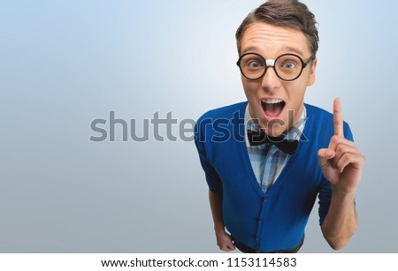 Young nerd man posing on background