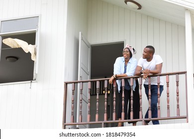 Young Newly Wed African American Couple Leaning On The Balcony At Home With Copy Space