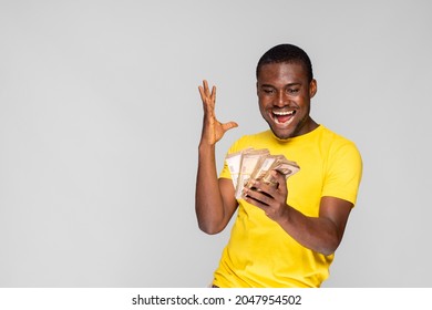 Young Nigerian Man Rejoicing While Holding A Lot Of Money He Won