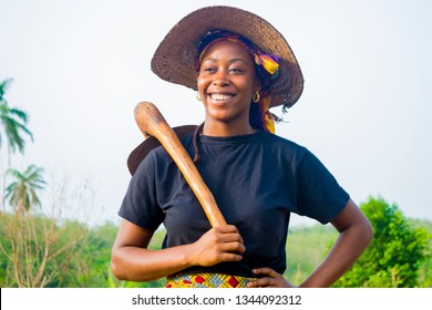 a young Nigerian woman feels happy working on farm 