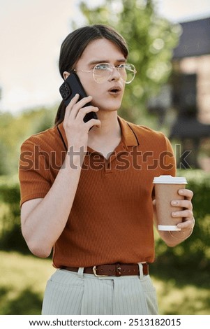 Similar – Image, Stock Photo Young non-binary person drinking juice standing in the doorway of a cafe